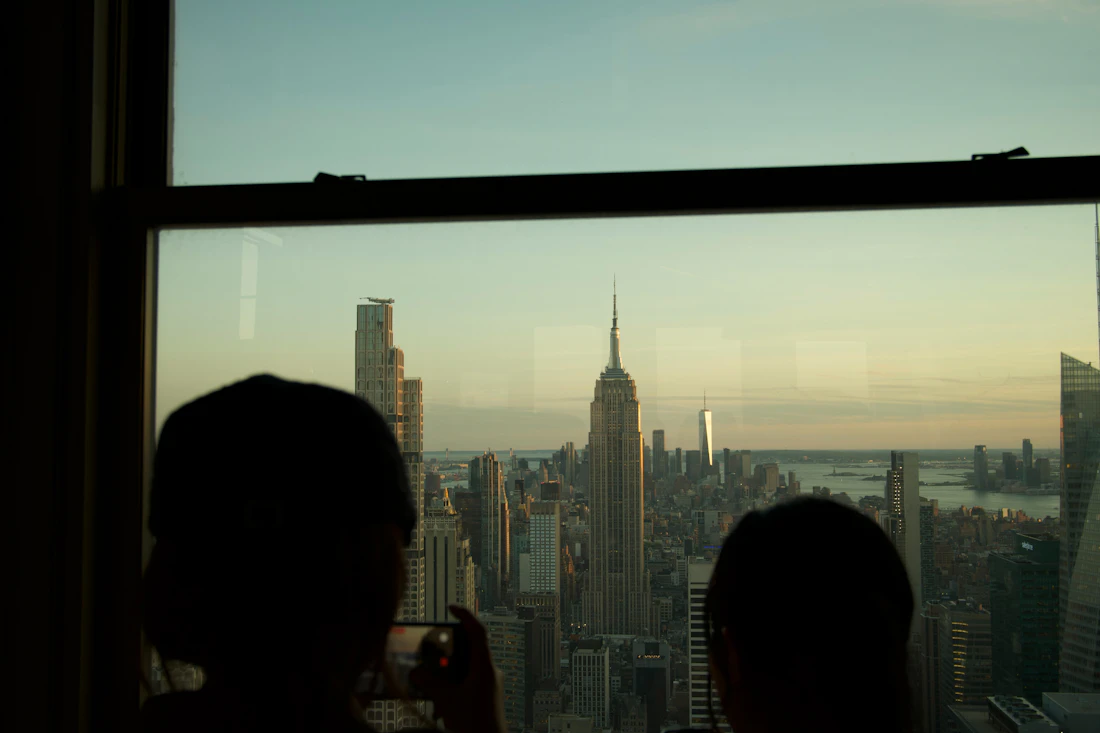 Two people together overlooking the Empire State Building in Manhattan